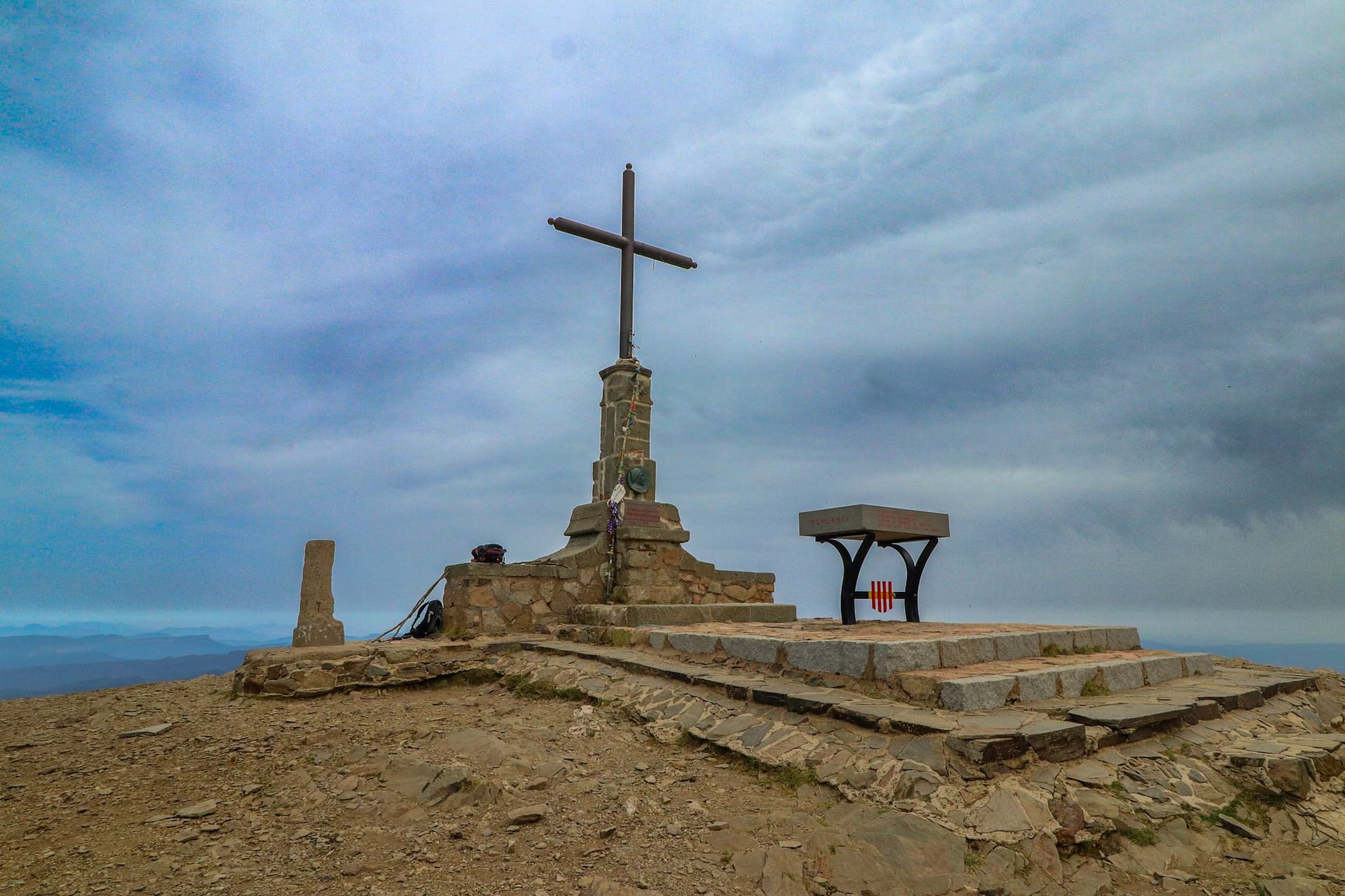 Les Agudes peak with its cross