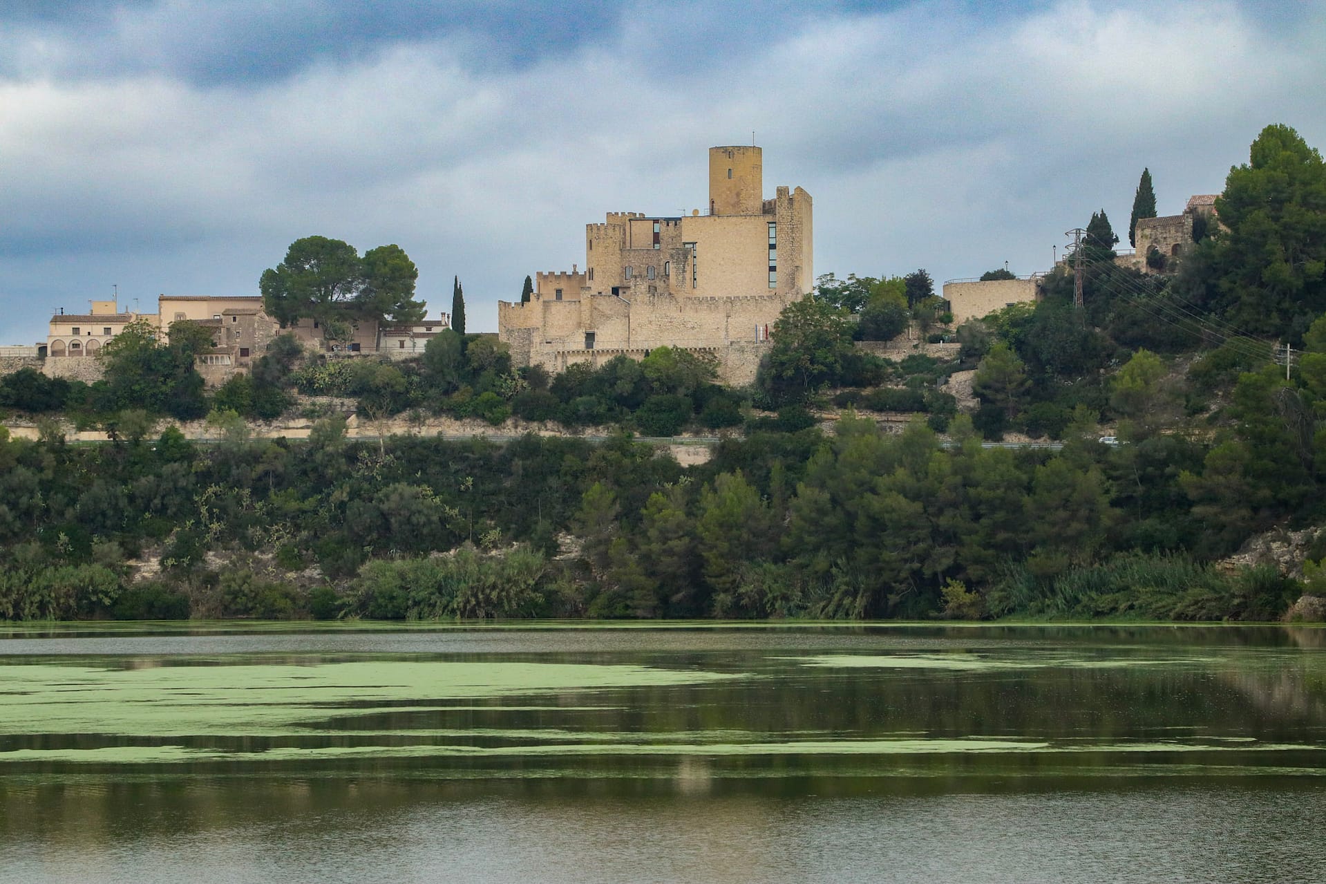 Olerdola castle beyond a lake